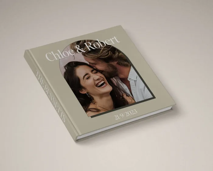 Fun wedding album cover design featuring wedding photo in modern arch frame